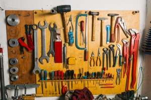Tools Hanging On A Wall In Workshop