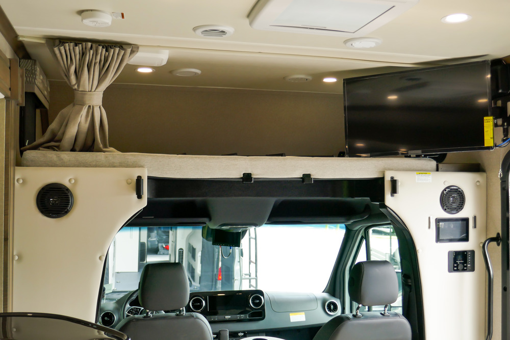 RV with a overhead bunkhouse storage area