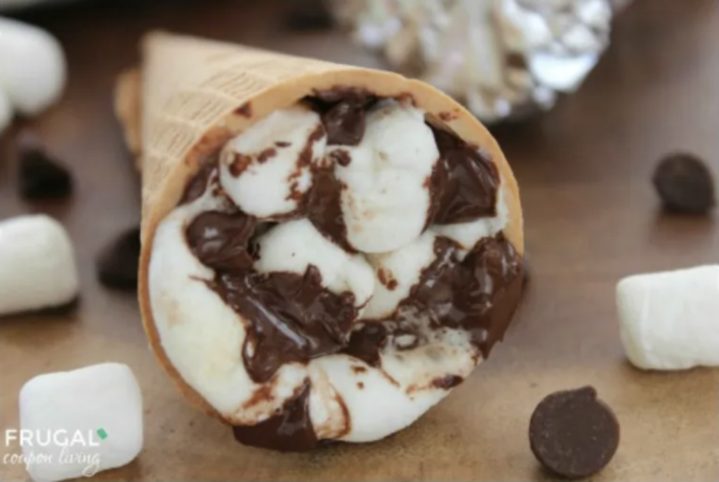 Waffle cones filled with marshmallows and melted chocolate make yummy fall campfire snacks