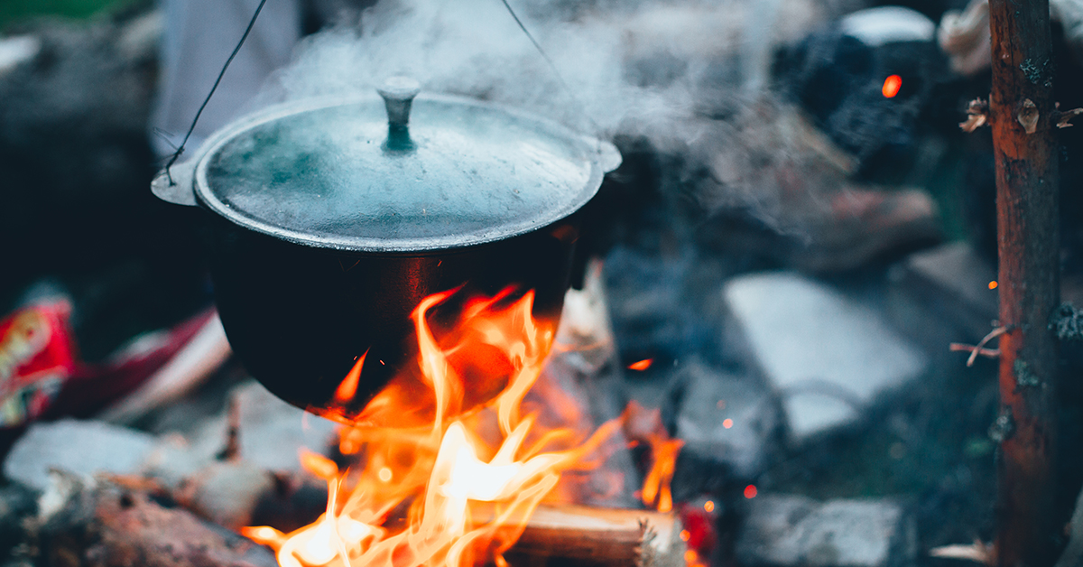 A Dutch oven over a campfire