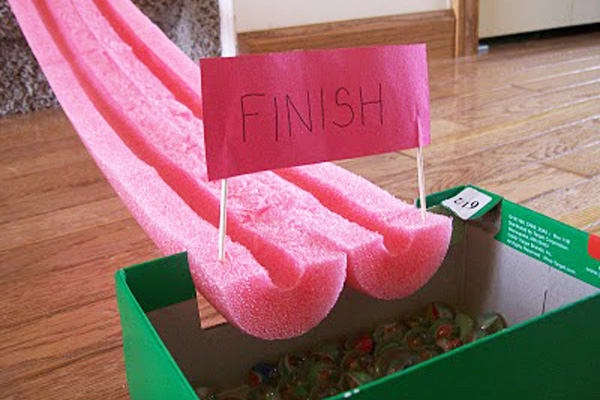 Half pipe marble luge