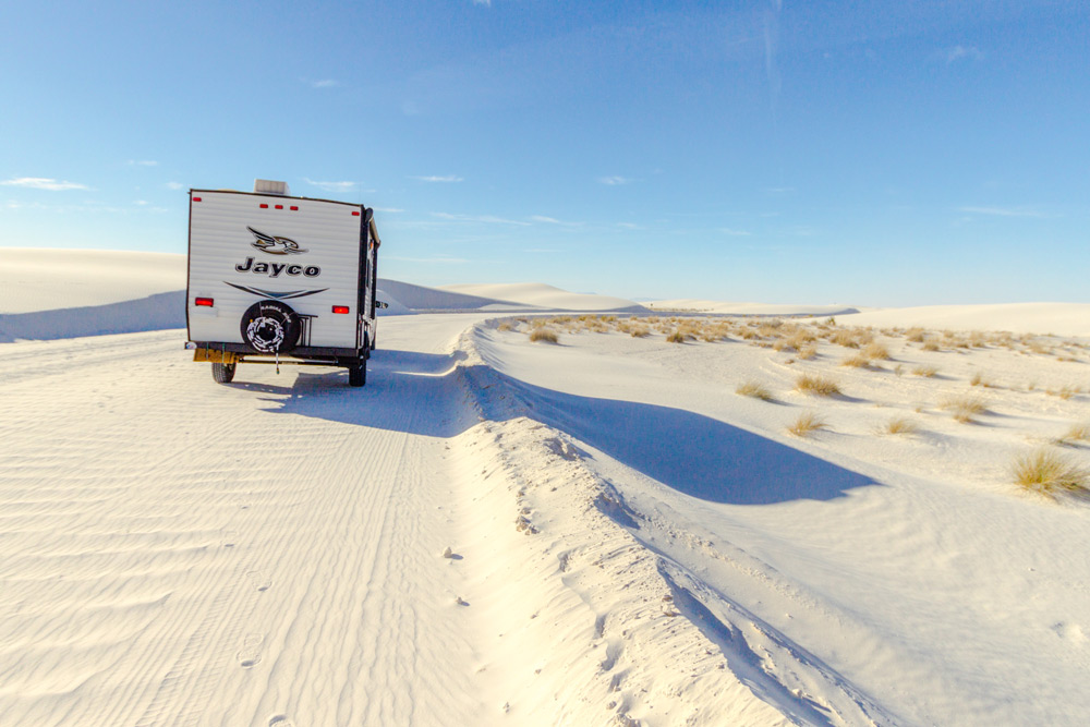 An RV drives through sand in New Mexico. Off-roading is one of the most popular ways to camp this year.