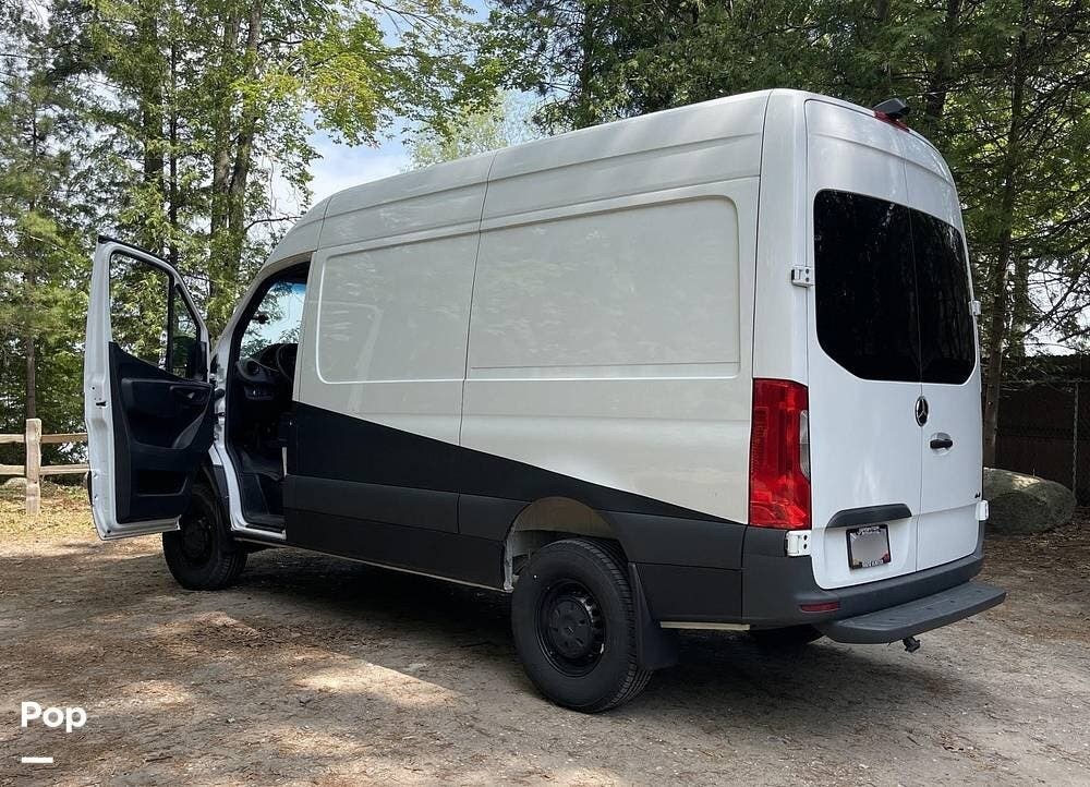 high top conversion van parked in the forest