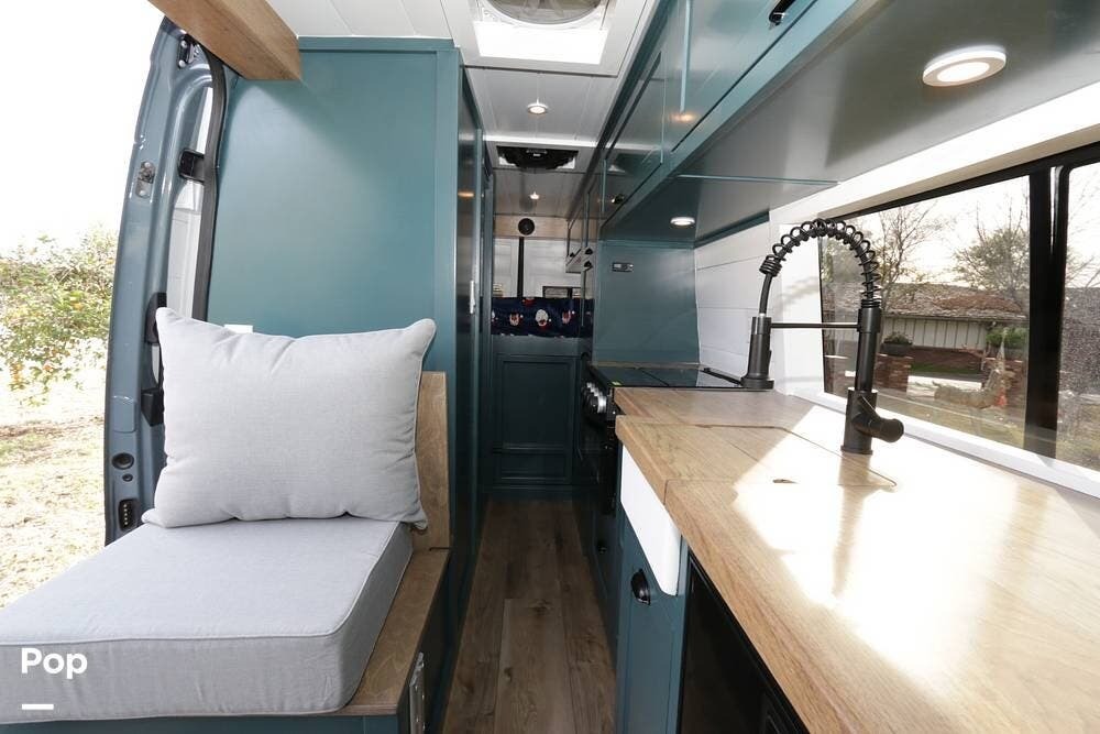 interior of 2021 Mercedes-Benz Sprinter 2021 Mercedes-Benz Sprinter with dark teal paint and a Vigo stone sink