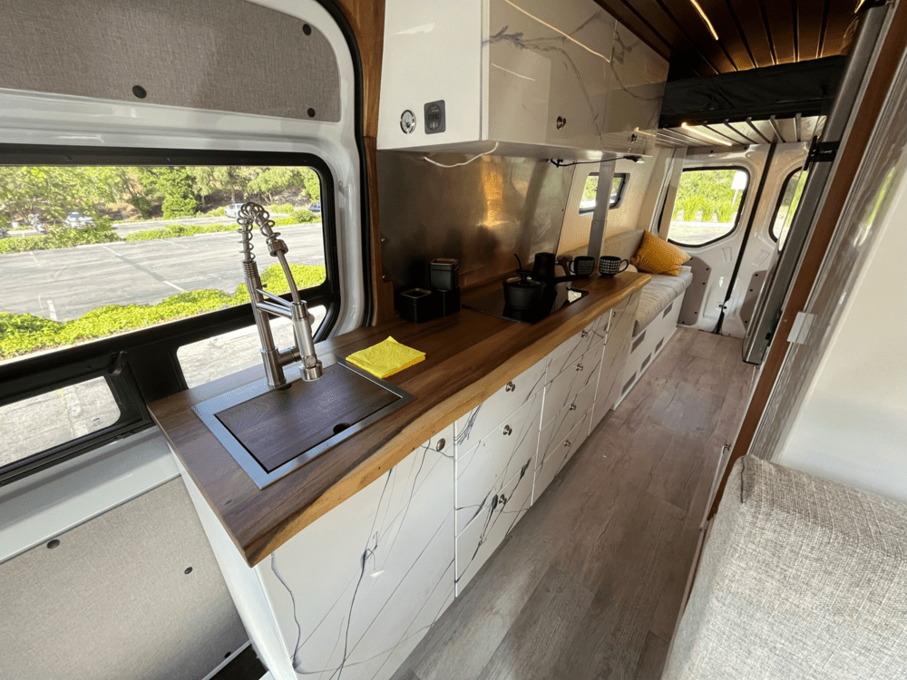 interior of 2021 Mercedes-Benz Sprinter interior of 2021 Mercedes-Benz Sprinter with marble cabinets and a powerlifting loft bed
