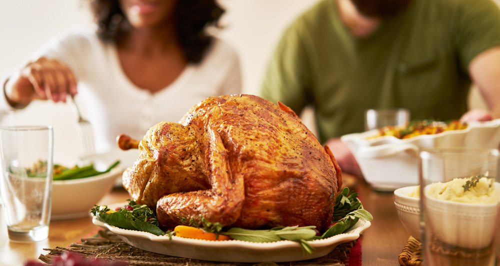 Thanksgiving turkey Thanksgiving dinner turkey with people eating