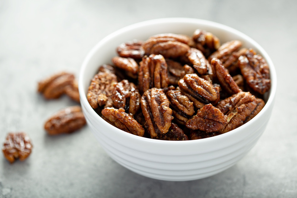 candied pecans in a white bowl