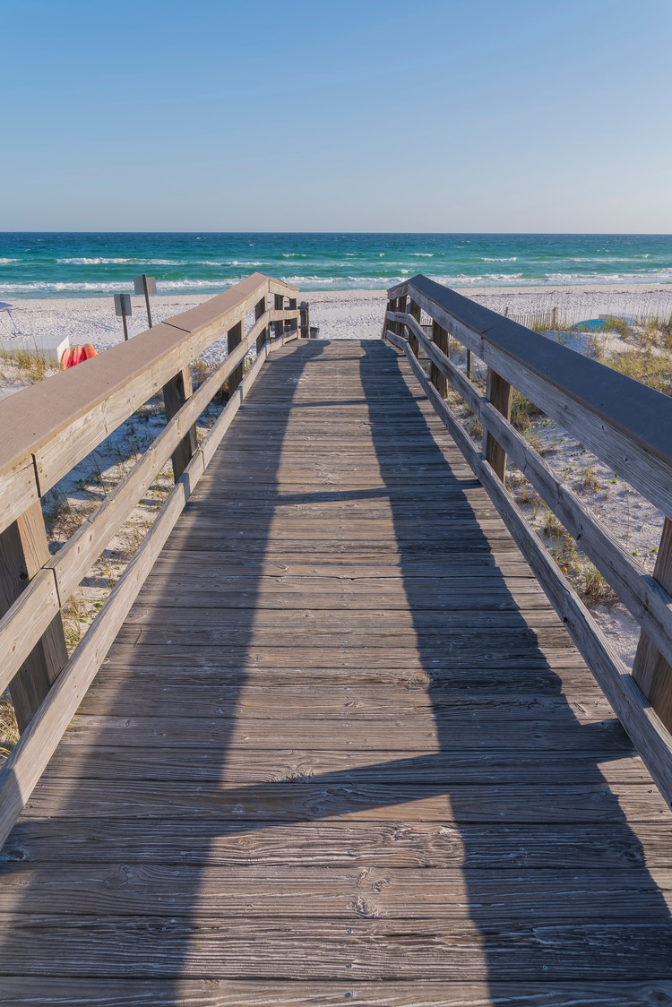 wooden beach walkway with railings at the beach in Destin, Florida