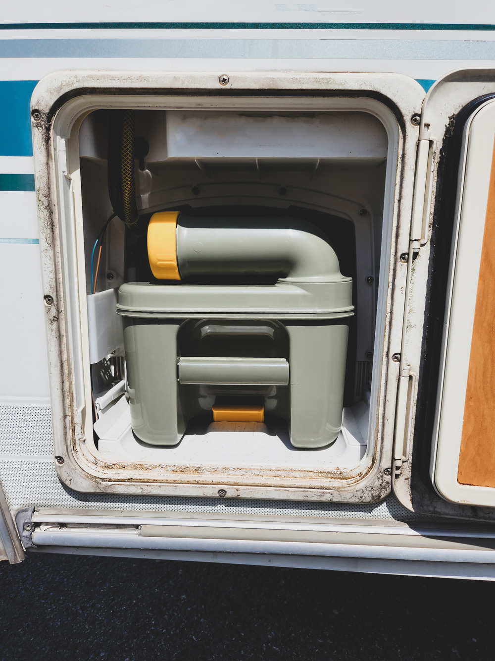 black water toilet cassette inside a camper van