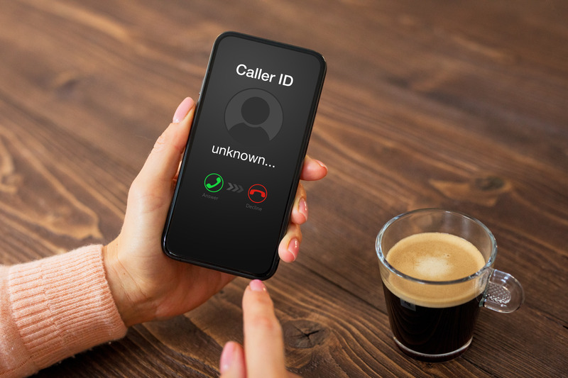 Smartphone showing an unknown caller ID. 