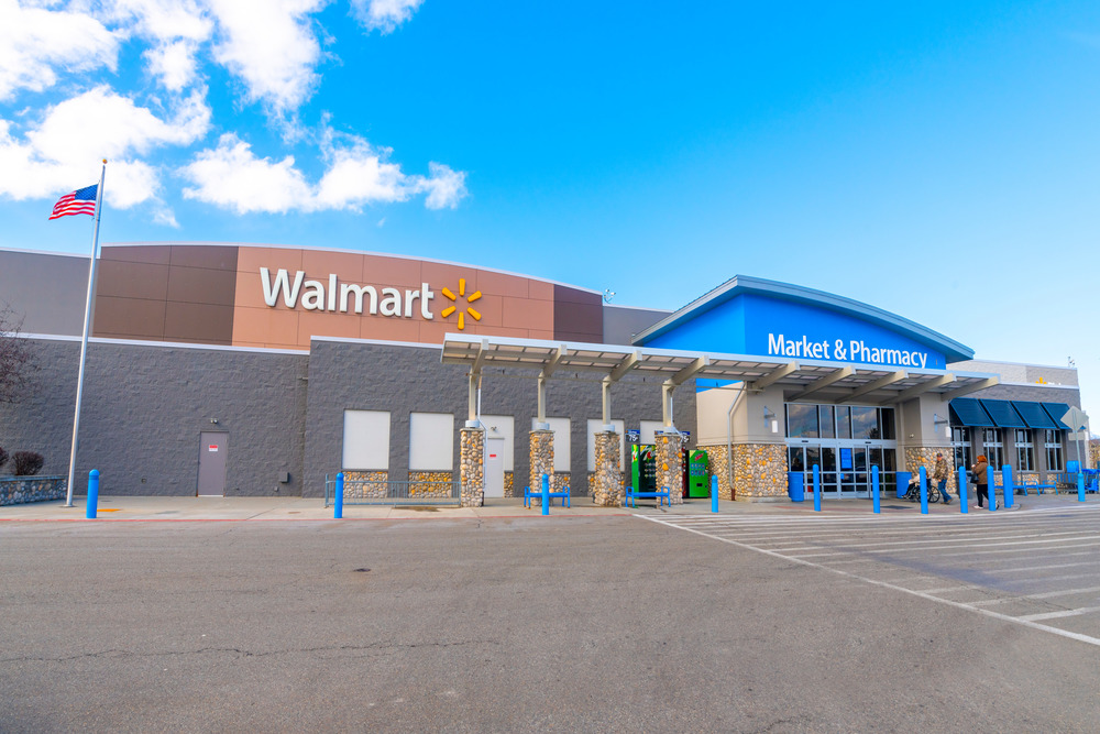sign and entrance of a Walmart Superstore market and pharmacy  from the parking lot