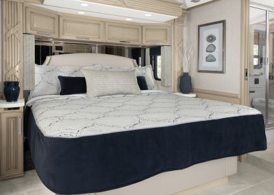 Bedroom of a 2024 Newmar Mountain Aire.