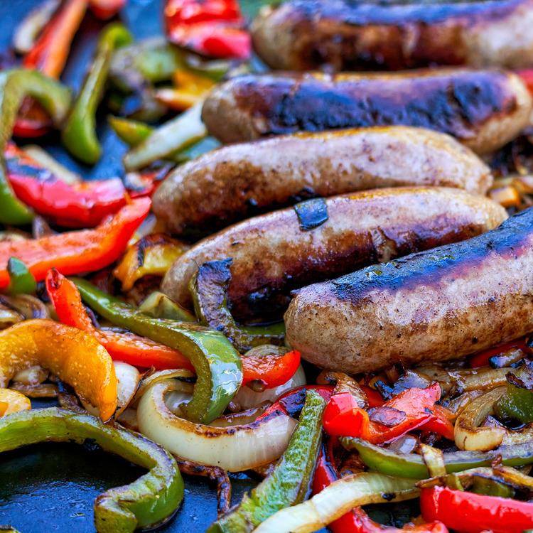 sausage, onions, and peppers on the grill