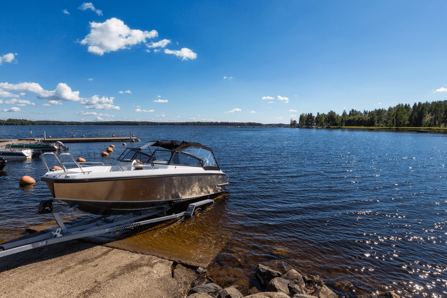 Boat being towed by an RV getting launched into the water