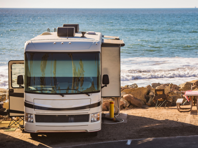 An RVUSA travel trailer at sunset
