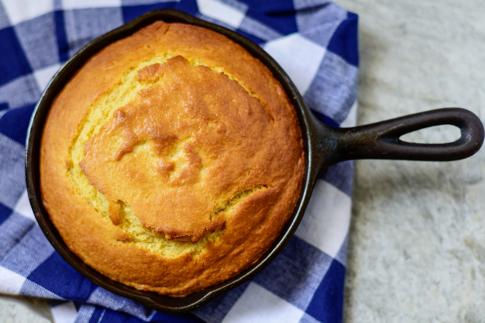 Cast Iron Cornbread sitting on top of a kitchen towel