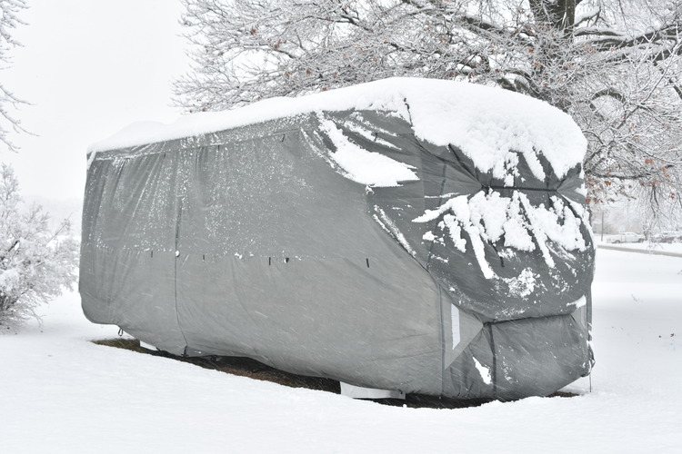 Snow on top of a RV Cover during winter