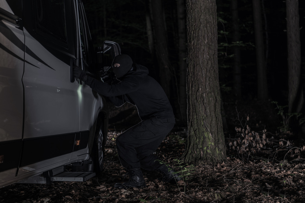 someone trying to steal an RV Camper at Night Time