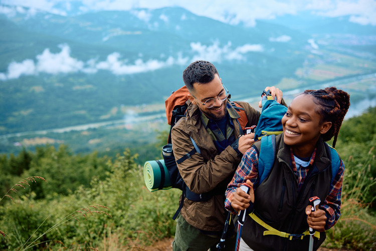 couple enjoys hiking through national park for a romantic vacation