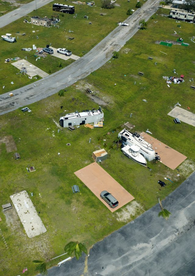 Hurricane damage to RVs and houses at a Florida RV campground.
