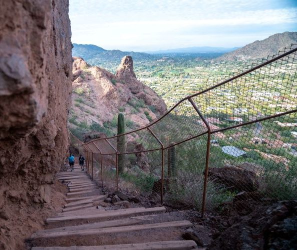 Hiking up Camelback Mountain Steps with Paradise Valley in the background