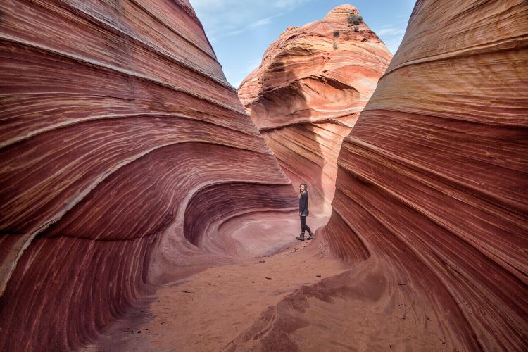 woman hiking Coyote Buttes North (the wave) in arizona
