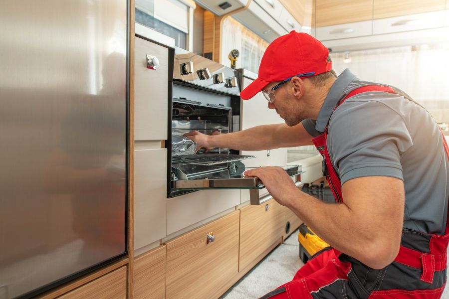 Man checking the appliances inside an rv