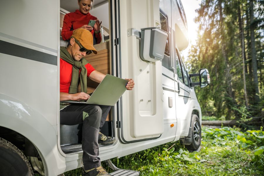 Couple Using Wireless Internet From Their RV