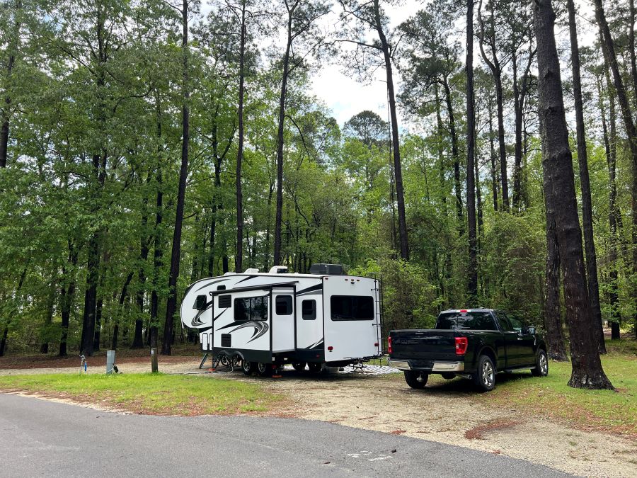A fifth wheel rv set up for camping 