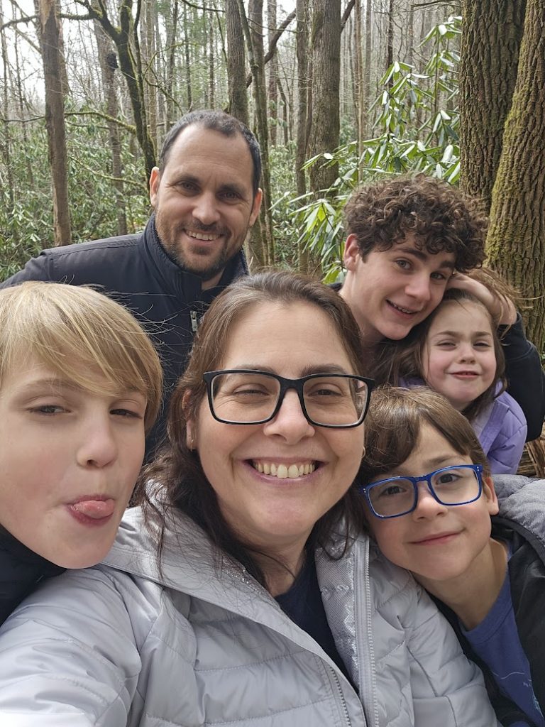 Selfie of Dana, her husband, and their four children. 