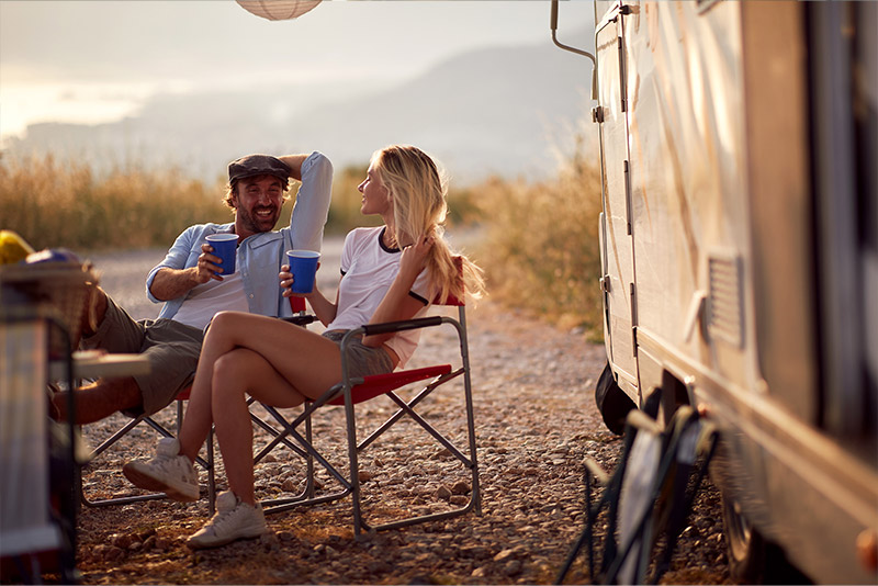 Couple enjoying campign in a RV
